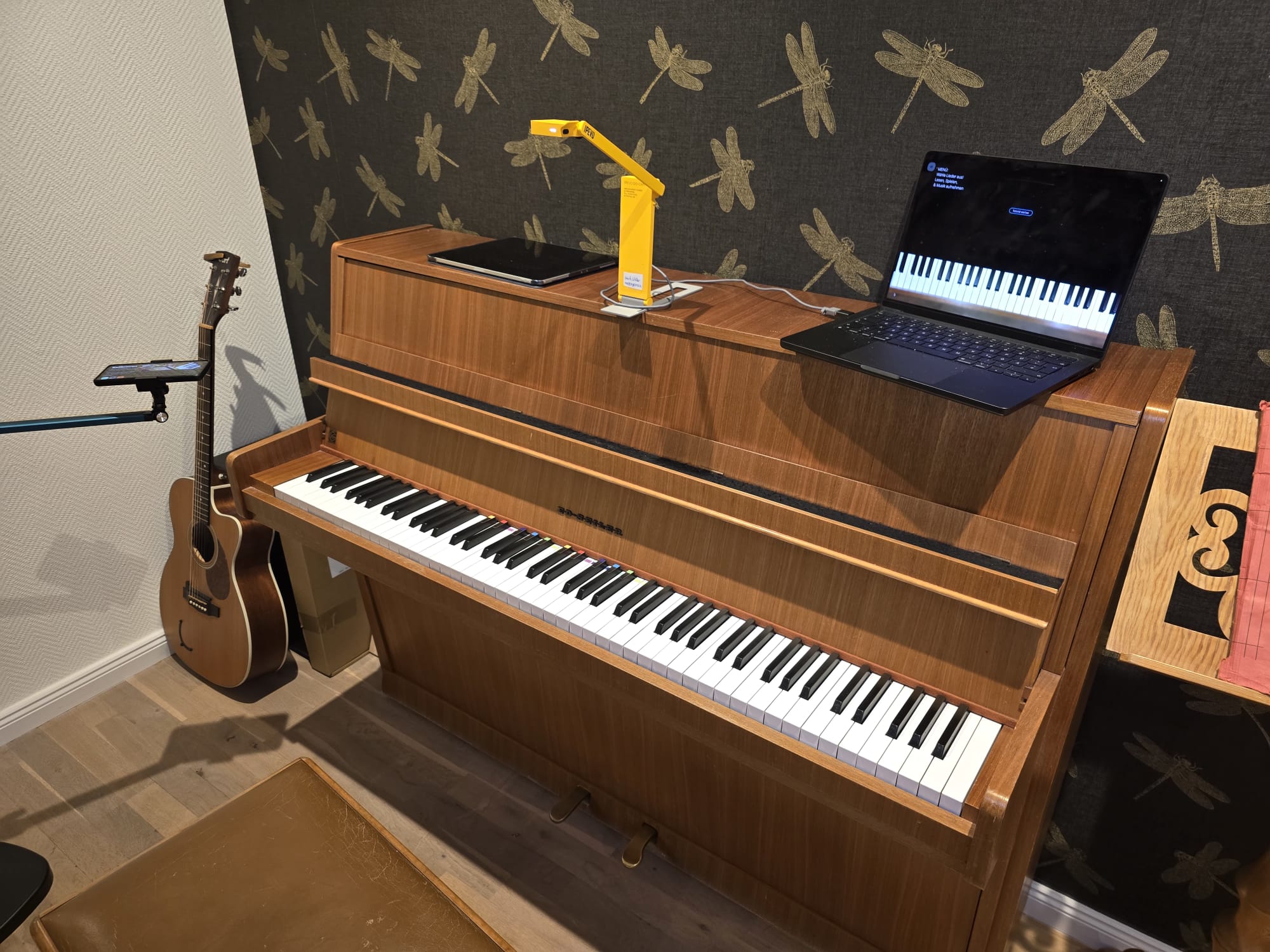 Laptop setup above a piano
