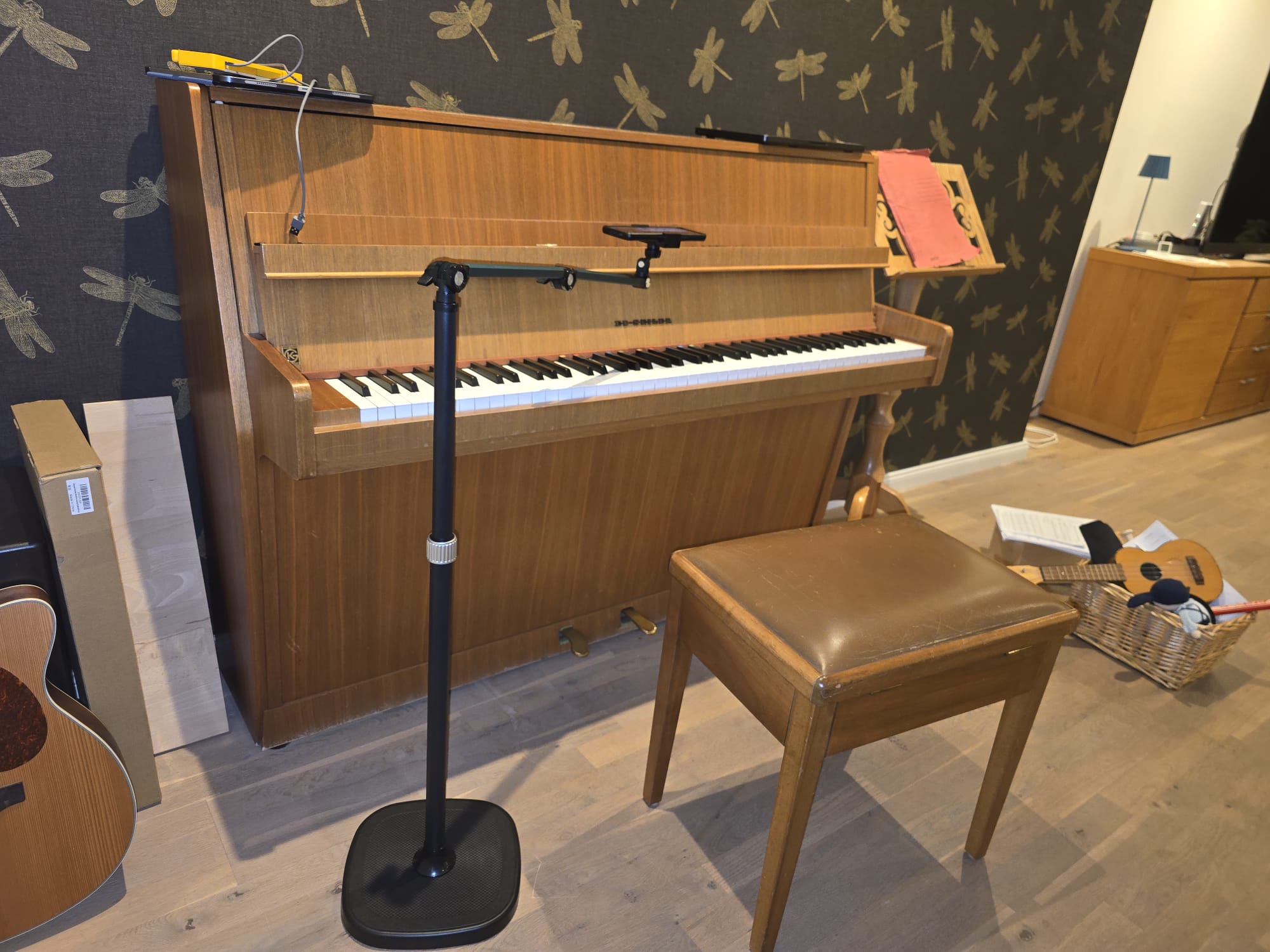 Phone setup above a piano